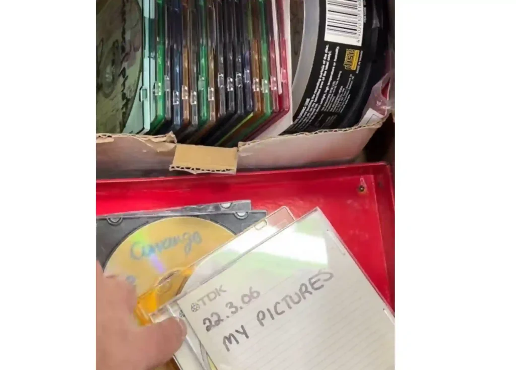 Stack of DVD's Getting converted to digital MP4 files ready to be uploaded to USB and cloud.